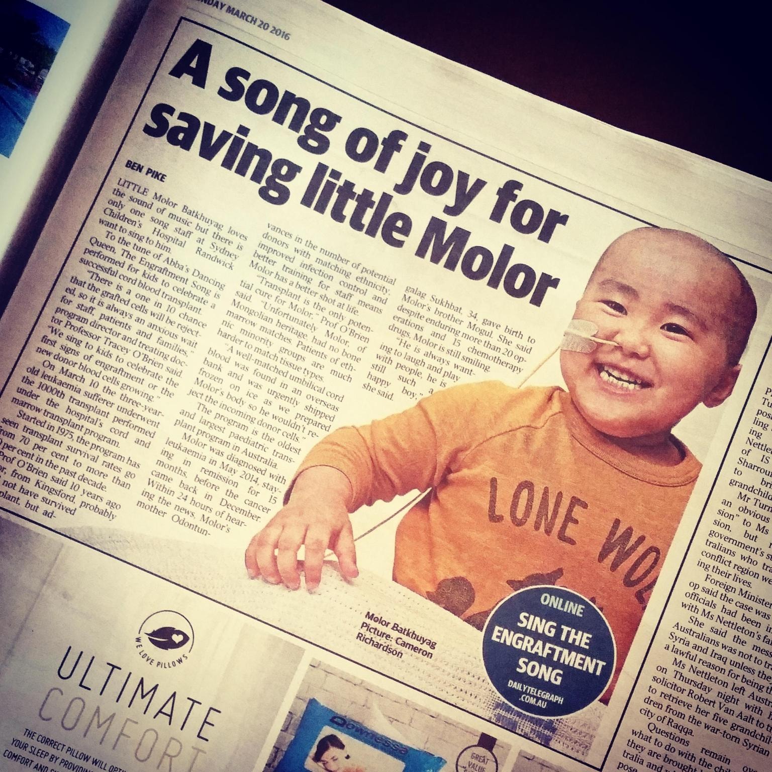 Smiling baby featured in newspaper article
